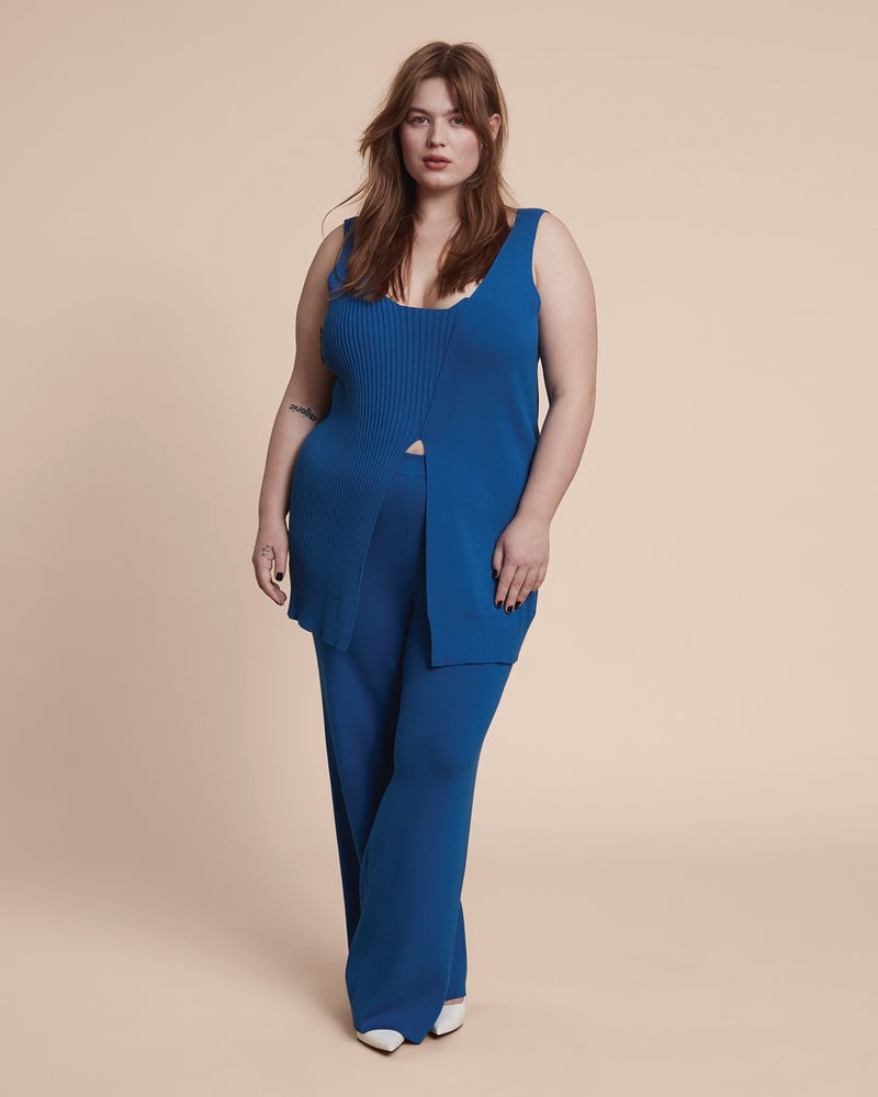 Front of a model wearing a plus size Celia Sweater Pant in Cerulean Blue by 11 Honoré Collection. | dia_product_style_image_id:231236